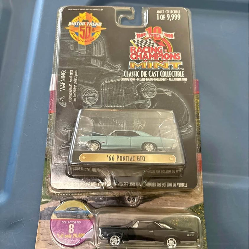 1966 Pontiac GTO diecast model car in blister pack, light green with tan base