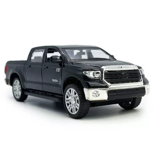 Black diecast pickup truck model car with silver grille detail