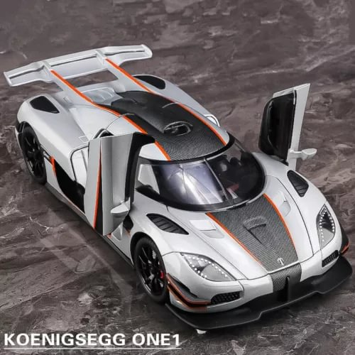 Koenigsegg ONE 1 diecast sports car model with orange accents, front 3/4 view