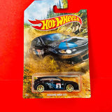Hot Wheels Subaru WRX STI black diecast car with blue stripe, blister pack