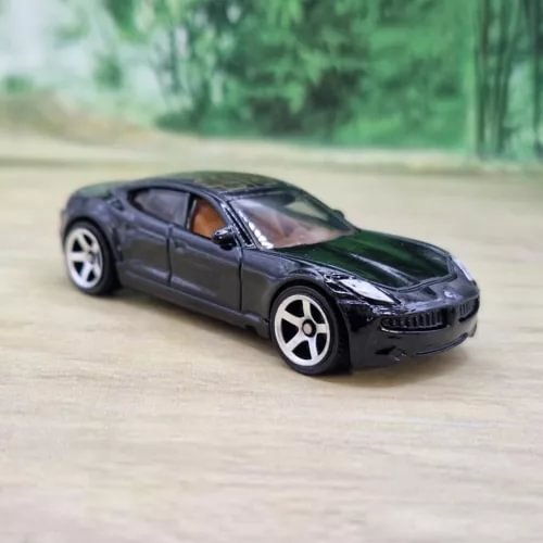Fisker Karma diecast model car in dark gray, front 3/4 view, white wheels