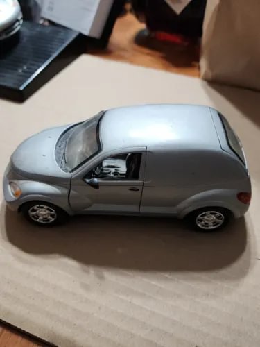 1:24 scale 2001 PT Cruiser diecast car model, silver, side view