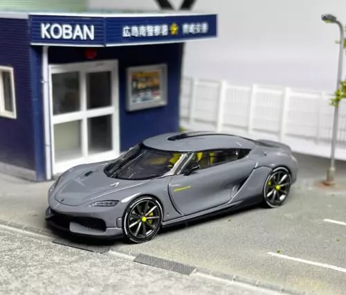 Gray diecast sports car model with black hood stripe and black wheels