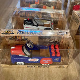 Miniature pedal car diecast in retail box, red and blue with steering wheel and small wheels