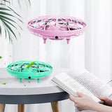 Mini induction levitation flying UFO toy with pink and green hovering discs