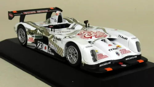 Diecast race car model, white with black aero and orange accents, front three-quarter view