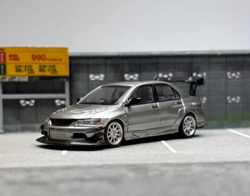 Silver 1:64 JDM Evo 9 diecast model car, detailed front and side view