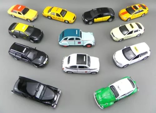 Assorted diecast taxi cab cars, multicolor, top view, various details visible