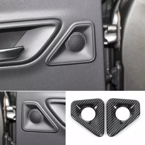 Car door panel speaker grille with speaker trim and carbon-fiber corner pieces
