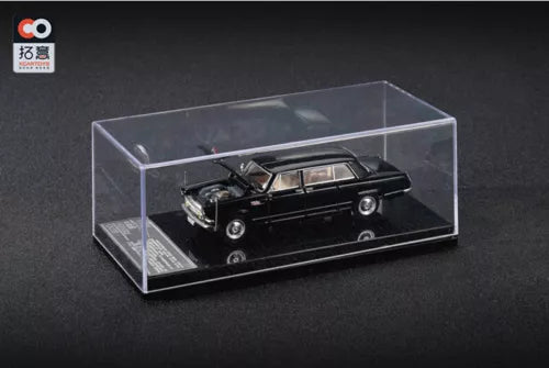 Black diecast model car in clear display case, 1:64 scale