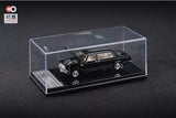 Black diecast model car in clear display case, 1:64 scale
