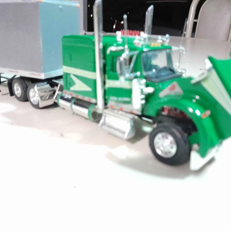 Green diecast semi truck with chrome grille and sleeper cab