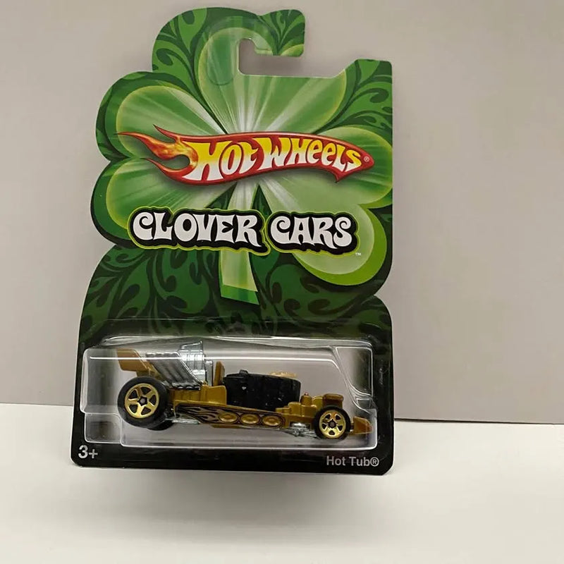 Hot Wheels Clover Cars diecast vehicle in blister pack, gold and black race car