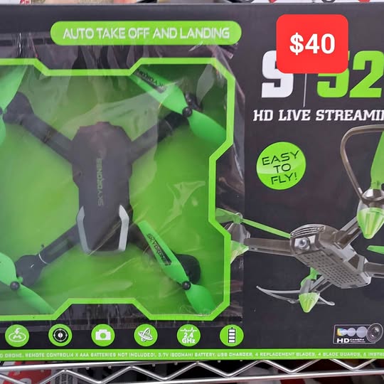 Green quadcopter drone with camera, four propellers