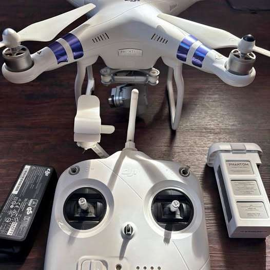 White DJI Phantom 3 Standard quadcopter drone with front camera gimbal