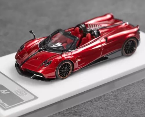 Red convertible sports diecast car with black accents, open cockpit, front view