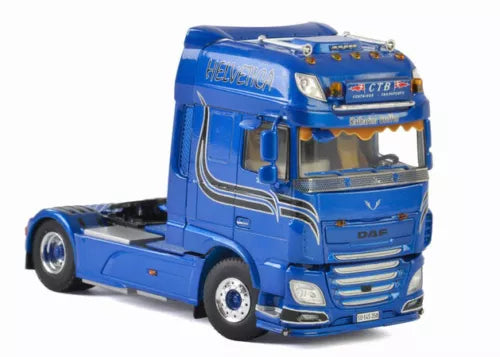 Blue diecast model truck cab, front 3/4 view with grille and headlights
