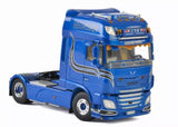 Blue diecast model truck cab, front 3/4 view with grille and headlights