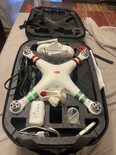 DJI Phantom standard camera drone with remote and accessories in black case