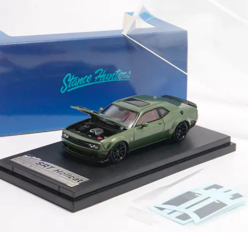 Green muscle diecast car toy with front-left view on display base