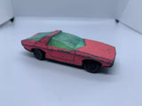 Used diecast model car, red body with green hood, side view
