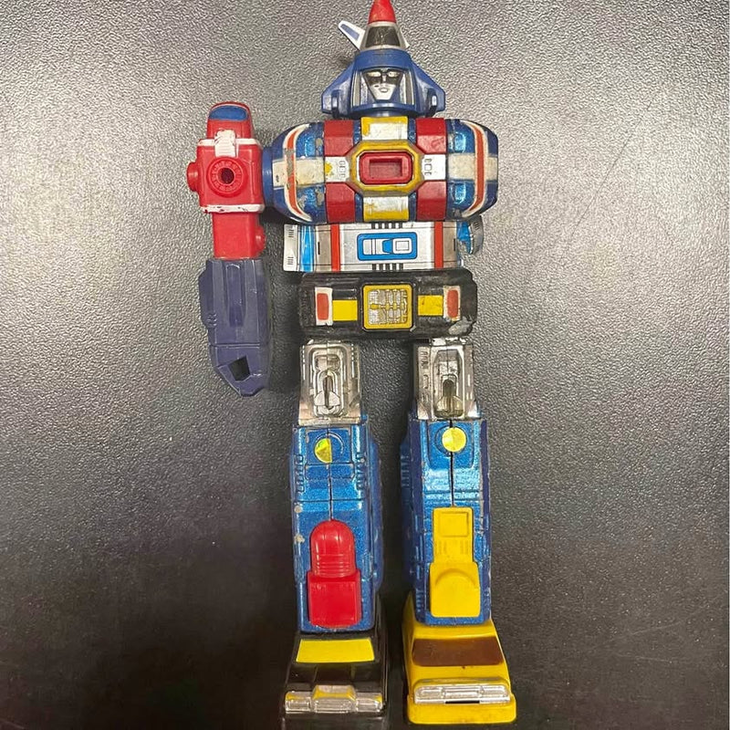 Diecast robot action figure with blue, red, and yellow armor