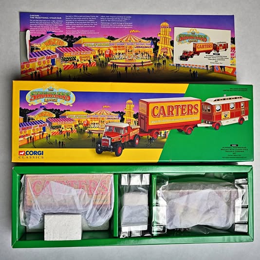 Circus truck diecast set in retail box, featuring red and yellow trucks labeled Carters