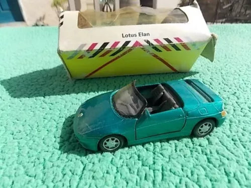 Lotus Elan diecast sports car toy, teal with black wheels and windshield