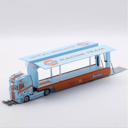 Enclosed double-deck Gulf diecast truck model, light blue cab and orange body, raised roof.