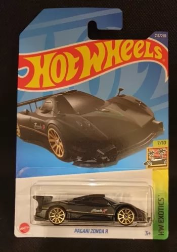 Diecast model car on retail card, black Pagani Zonda R with gold wheels