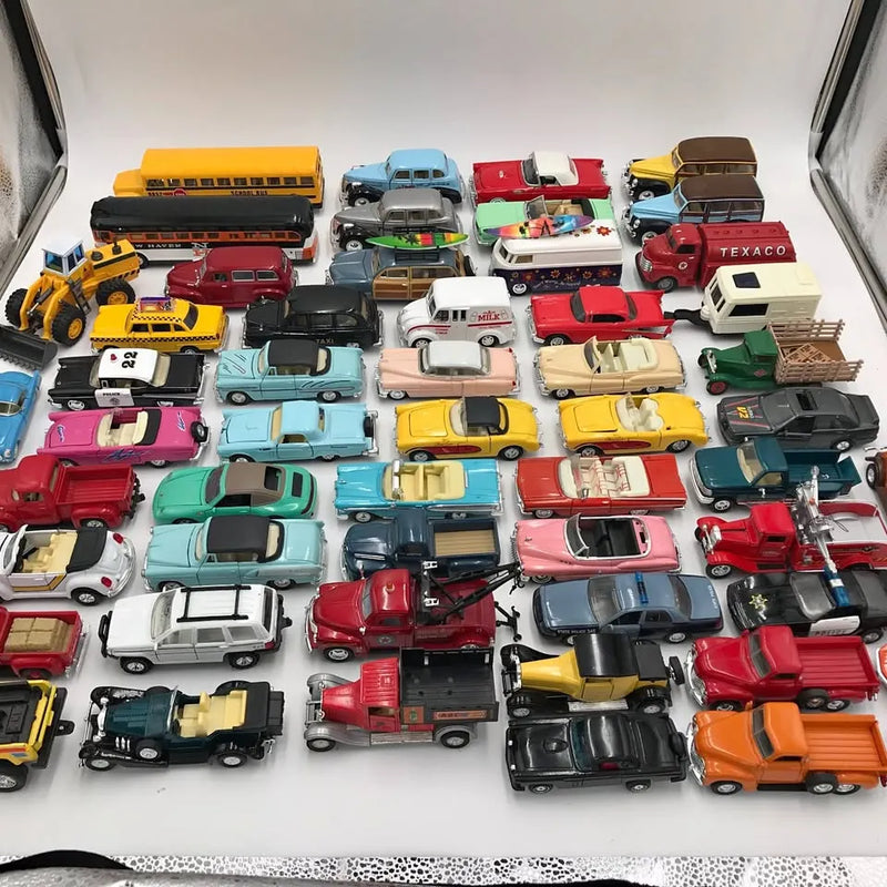 Assorted diecast model vehicles: cars, trucks and buses in mixed colors