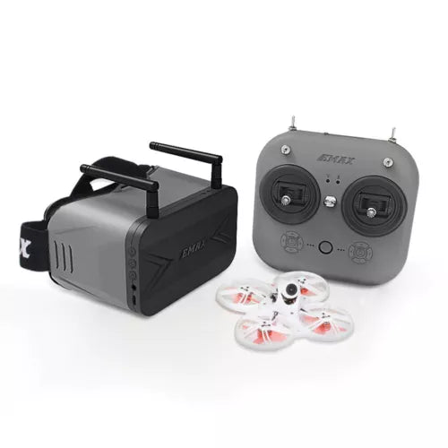 FPV drone kit with grey controller, black drone, and two small propeller frames