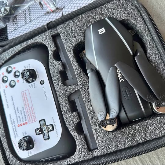 RC drone kit in carrying case with controller screen and foldable drone