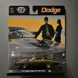 Black and orange diecast Dodge Charger RT 440 with gold wheels in blister pack