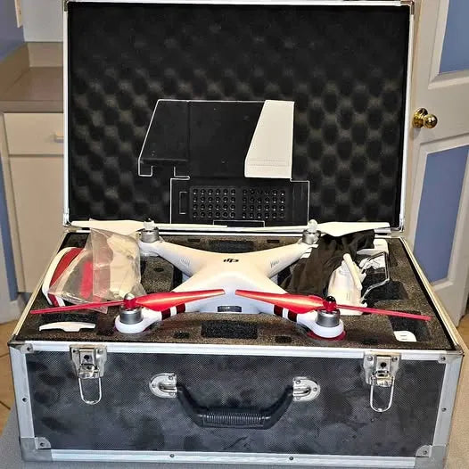 DJI Phantom 3 Standard drone in open hard case, white body with red accents