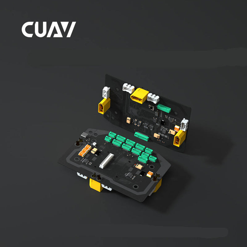 Custom flight controller PCB with green terminal blocks and yellow connectors