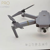 Gray foldable quadcopter drone with front camera and rotating propellers