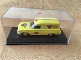 Yellow diecast panel van model in display case