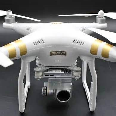 DJI Phantom 3 Professional quadcopter with front camera and four white prop arms