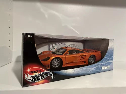 Orange diecast model sports car in retail Hot Wheels box, front view
