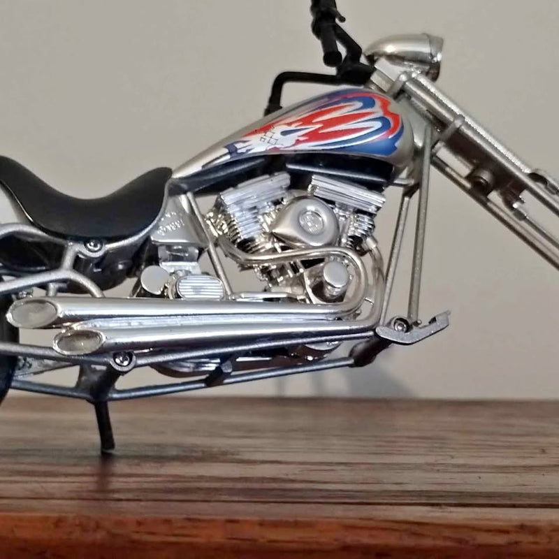 Diecast chopper motorcycle with chrome engine and blue-red fuel tank