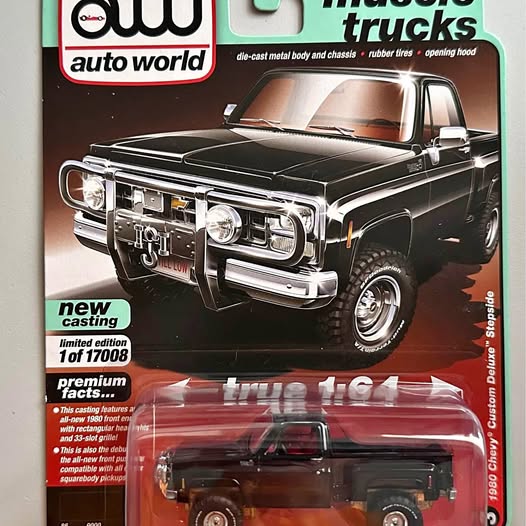 Black diecast pickup truck model in retail packaging, chrome grille and front headlights