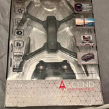 Foldable drone in retail packaging, hex-pattern blister with central body and prop guards