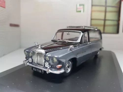 1:43 diecast hearse model car, dark grey with chrome grille and front lights