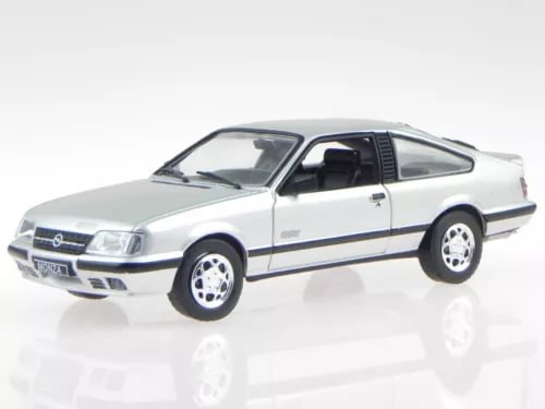 Silver diecast car model, white roof, side view with open front window