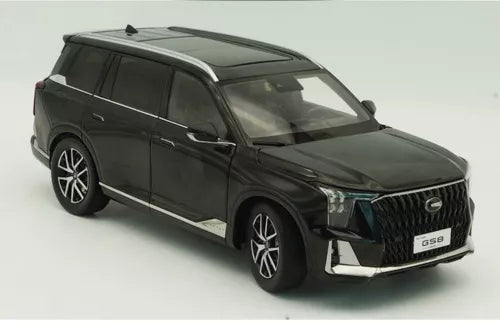 Black 1/18 diecast SUV model car, front 3/4 view with grille and headlights