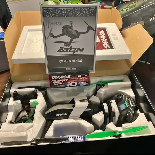 RC drone kit with Traxxas Atxn drone, green propellers and controller, in retail box