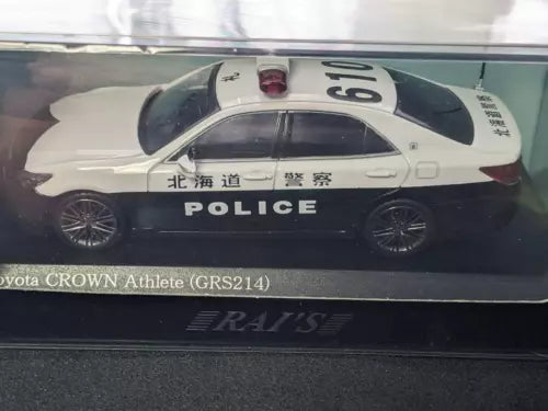 1/64 police car diecast model with white body, black roof, roof number 61
