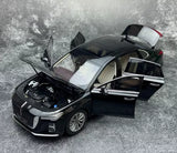 1/18 scale black diecast sedan model car with hood and driver-side door open