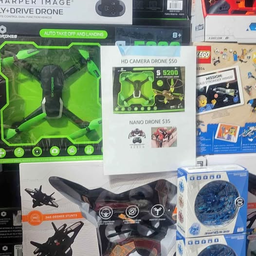 Camera drone in retail packaging with propeller and controller icons